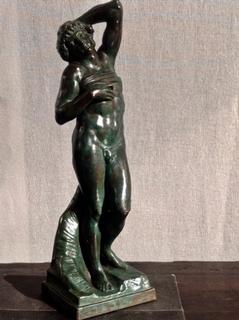 A 19th Century sculpture of one of Michelangelo's Slaves ( intended for the Pope  Julius II 's Tombe ( 1513-1515 ) . Original now in the Louvre.