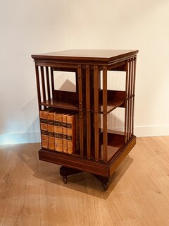 An English 19th. Century mahogany Revolving Bookcase having a Cast Iron Base.