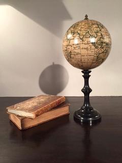 An English 20 th Century Small Terresterial Globe having a ebonised stand