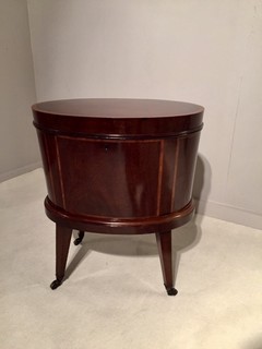 An English Edwardian Mahogany Wine Cooler on Castors and having a Satinwood Inlay. 