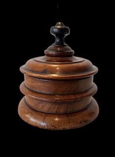 An early 19th century English turned walnut tobacco jar with its original ebony finial and a beautiful rich patina. A fine example of Georgian treen.