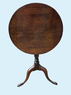 An English 18th Century Oak Tilt Top Table on a Tripod Base.