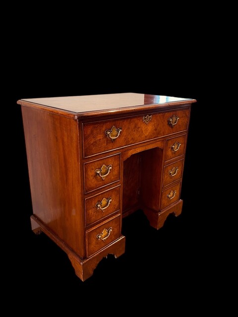 An English 19th Century Burr Walnut Kneehole Desk.