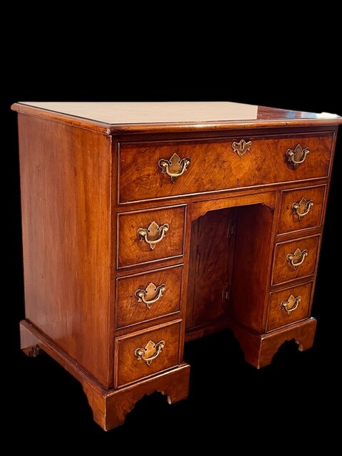 An English 19th Century Burr Walnut Kneehole Desk.