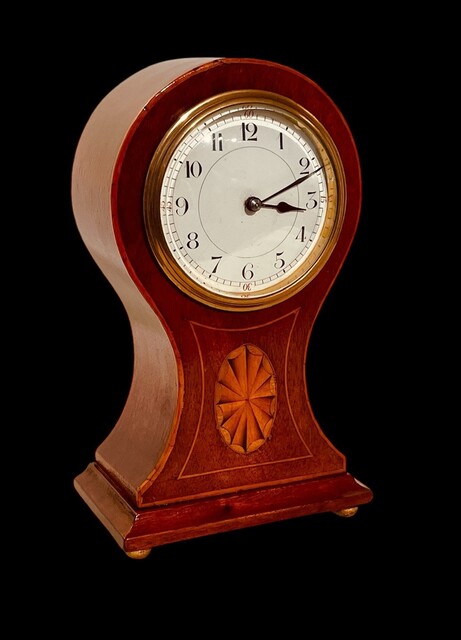 An English Edwardian Mahogany Balloon Mantel Clock having a Satinwood Inlay