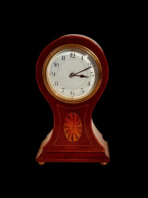 An English Edwardian Mahogany Balloon Mantel Clock having a Satinwood Inlay