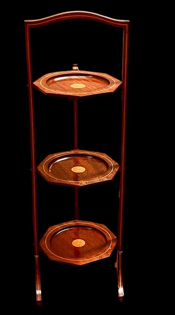 An English Edwardian Mahogany Folding Cakestand having a Satinwood Inlay