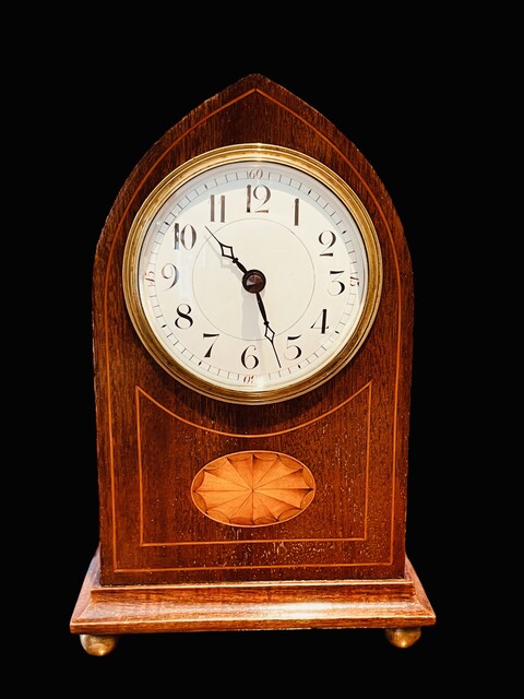 An English Edwardian Mahogany Mantel Clock having a Satinwood Inlay.