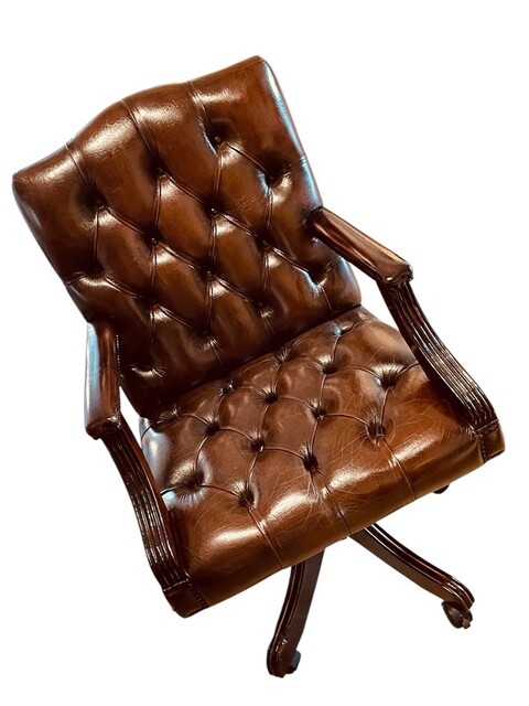 An English Swivel Chesterfield High Back Desk Chair adjustable in height 